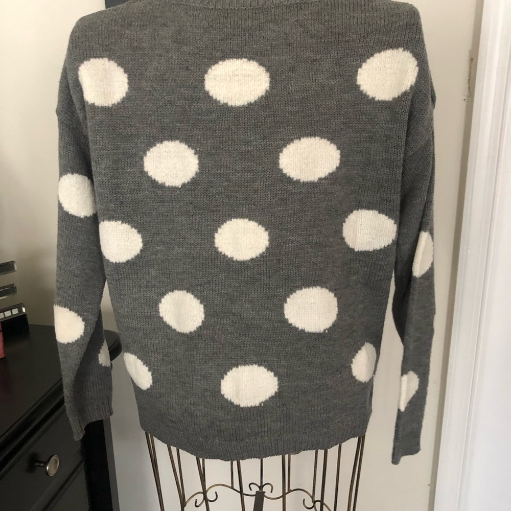 Gray long sleeve sweater with white polka dots.